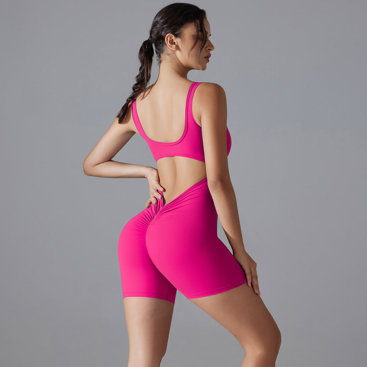 Flattering V-waist peach jumpsuit with a hip-lifting design. Stretchy, breathable, and perfect for workouts or casual wear