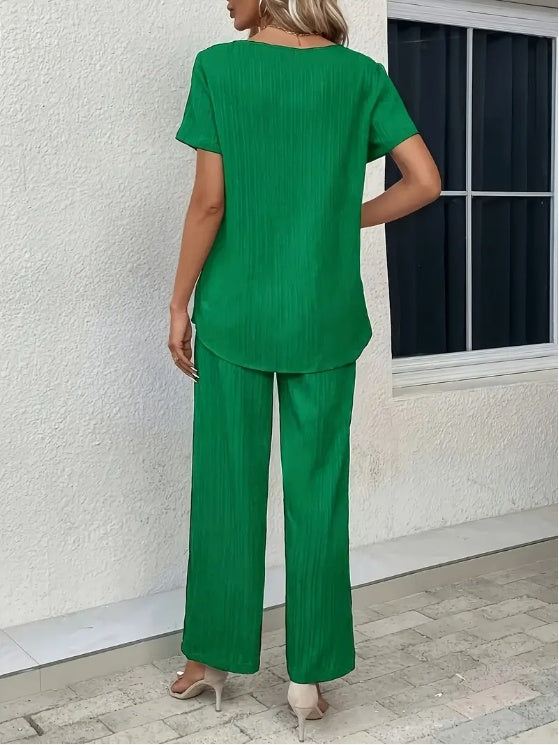 Sleek and comfortable 2-piece set with a crew neck top and long pants. Perfect for a polished yet relaxed everyday look.