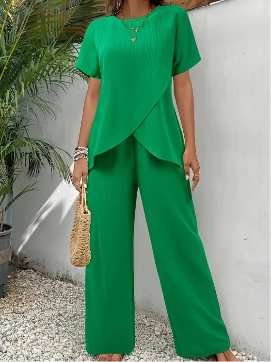 Sleek and comfortable 2-piece set with a crew neck top and long pants. Perfect for a polished yet relaxed everyday look.